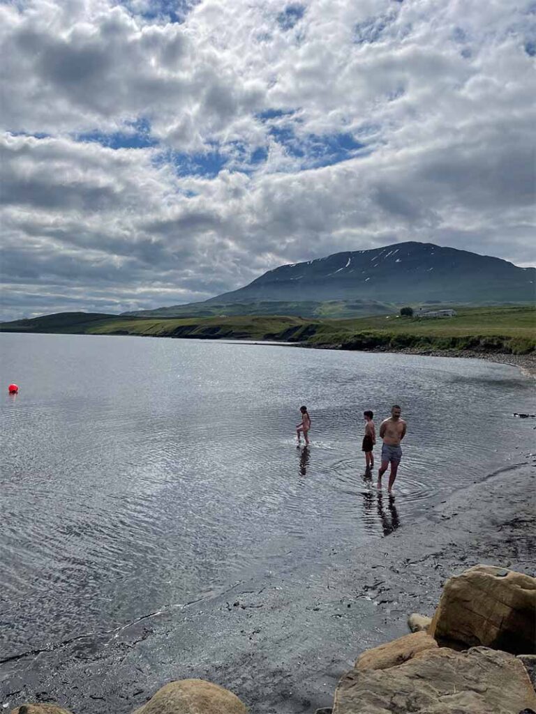 people on an Iceland retreat beach